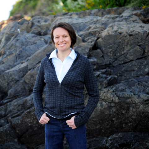 Katie Lotterhos standing in front of rocks 