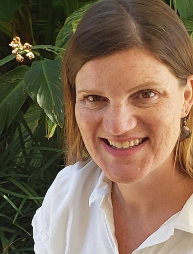 Headshot of Dr. Veronica Del Bianco with leafy plant in background 